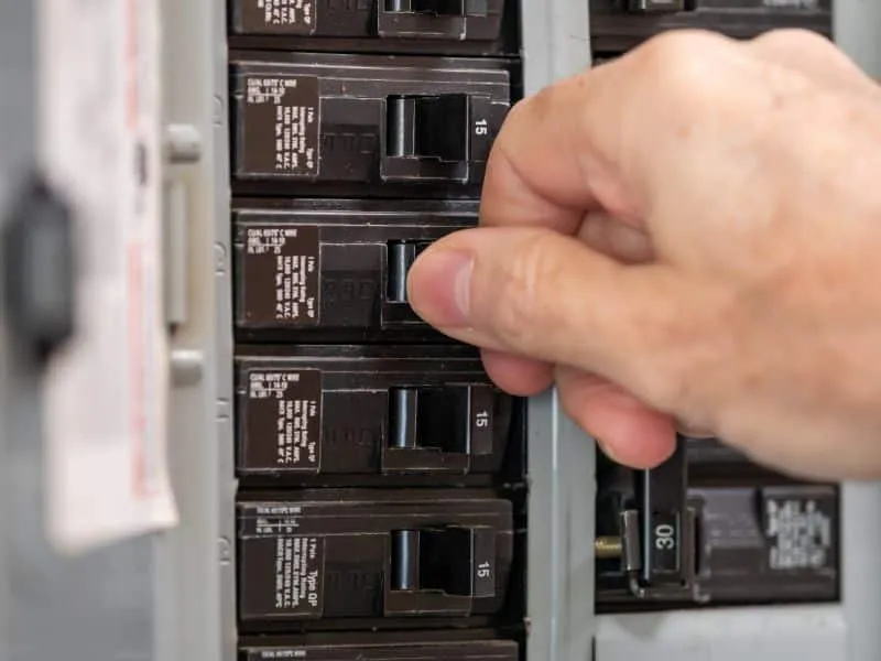 CNE electrician servicing a residential electrical panel